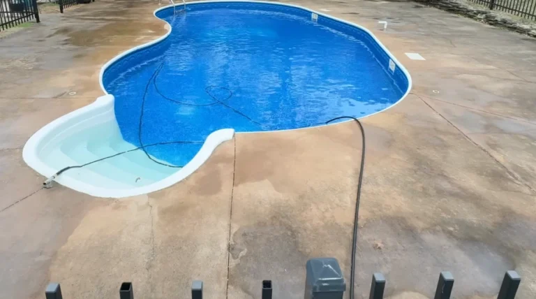 Slippery pool deck covered in algae before pressure washing in Brandon, FL